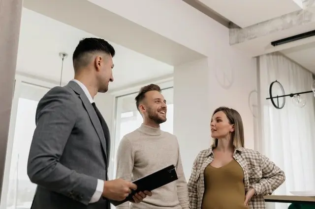 two people working with a real estate agent