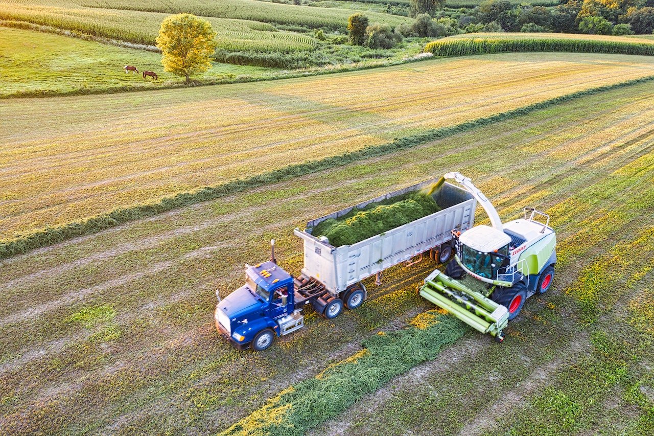tractor and trailer harvesting crops